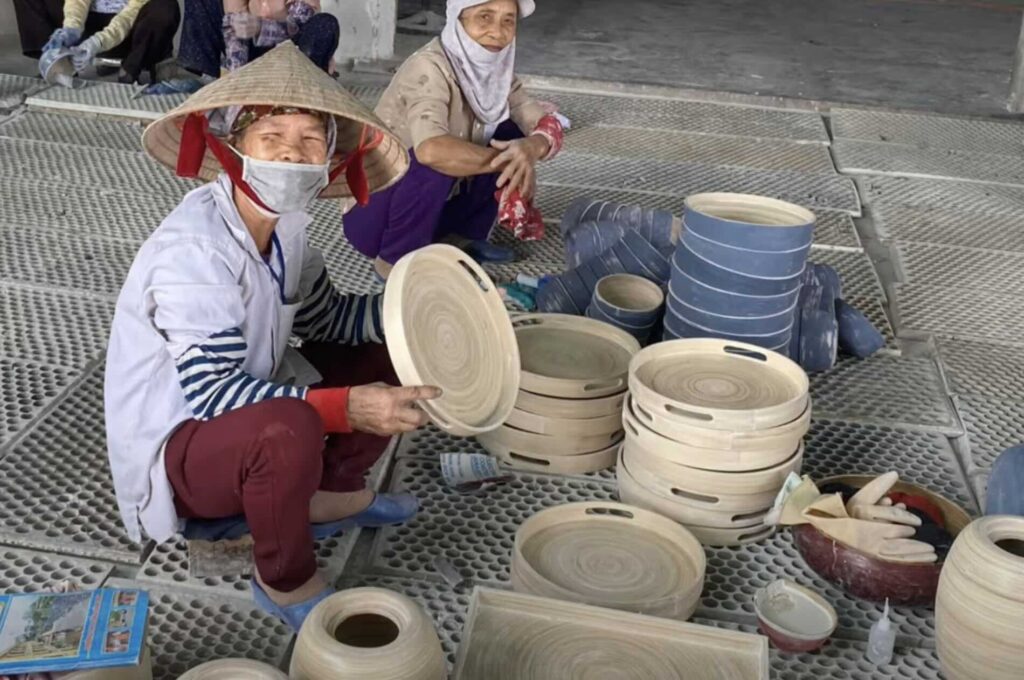 A photo of a couple cleaning a spun bamboo tray.
