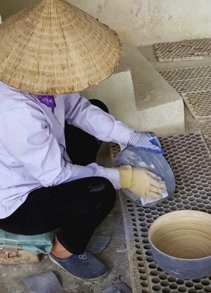 A photo of a girl cleaning the spun bamboo bowl